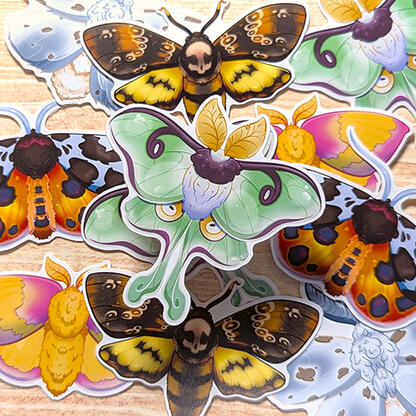 Pile of moth stickers showcasing different species: Luna, Death's-Head, Rosy Maple, Fall Webworm, and Tiger Garden.